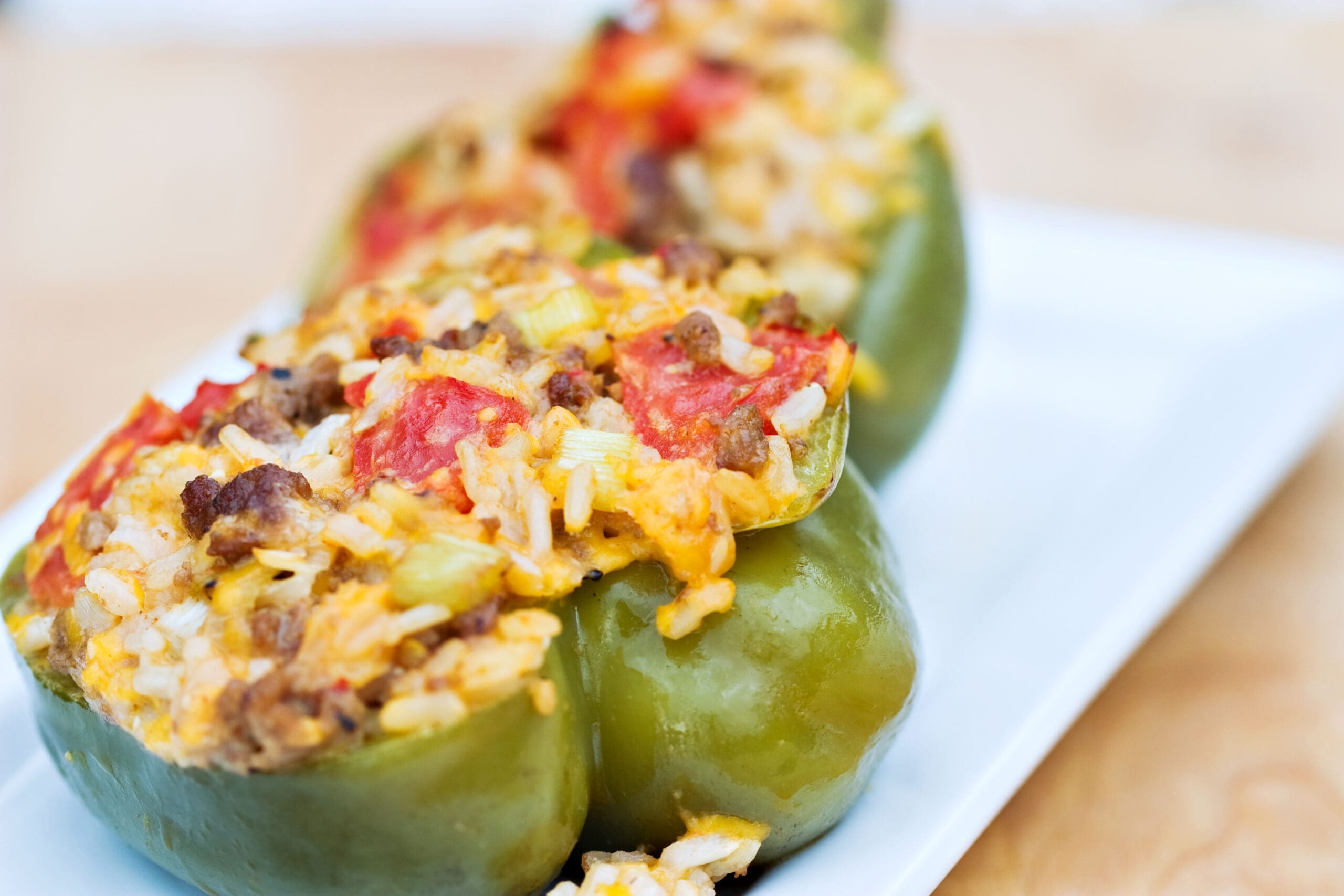 Green peppers stuffed with rice, cheese, meat and tomatoes